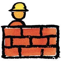 a construction worker sitting behind a brick wall