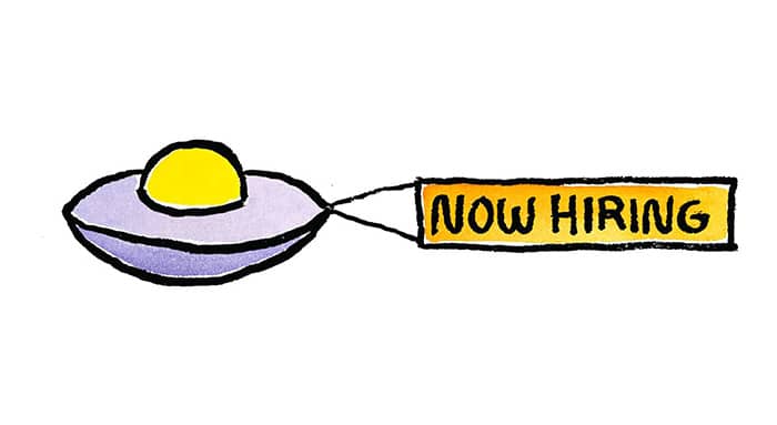 A UFO pulling a now hiring banner