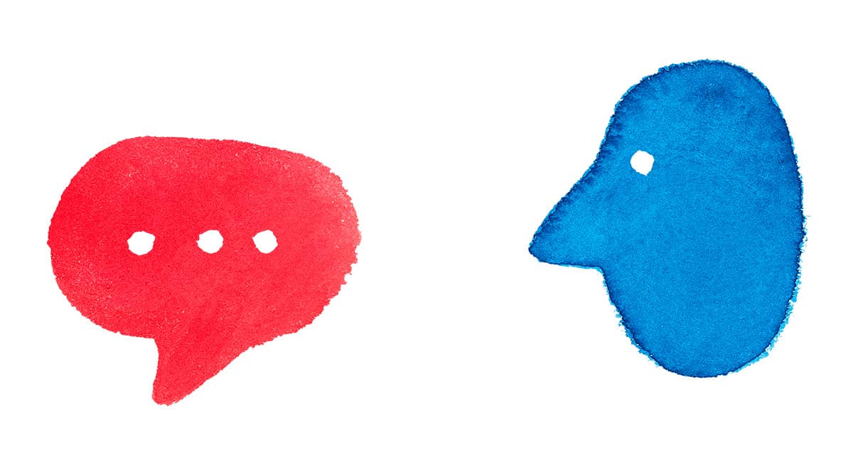 a red message bubble with a blue face next to it